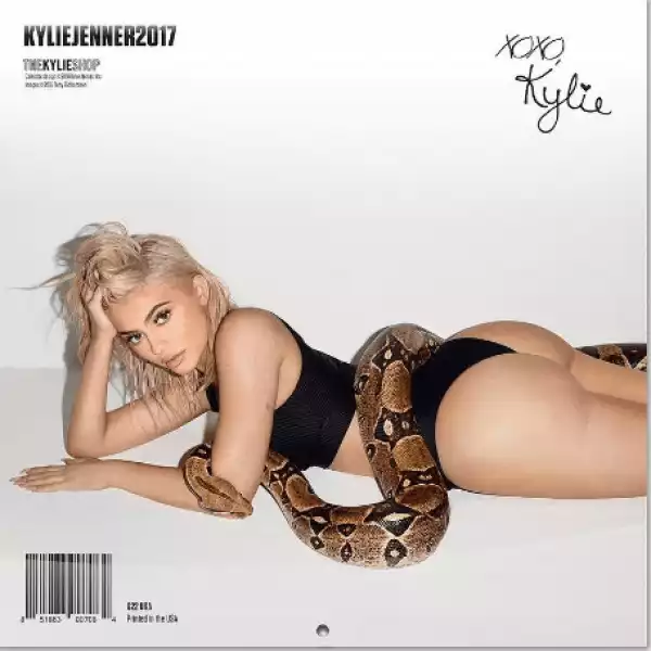 Kylie Jenner poses with a huge python for her 2017 calendar